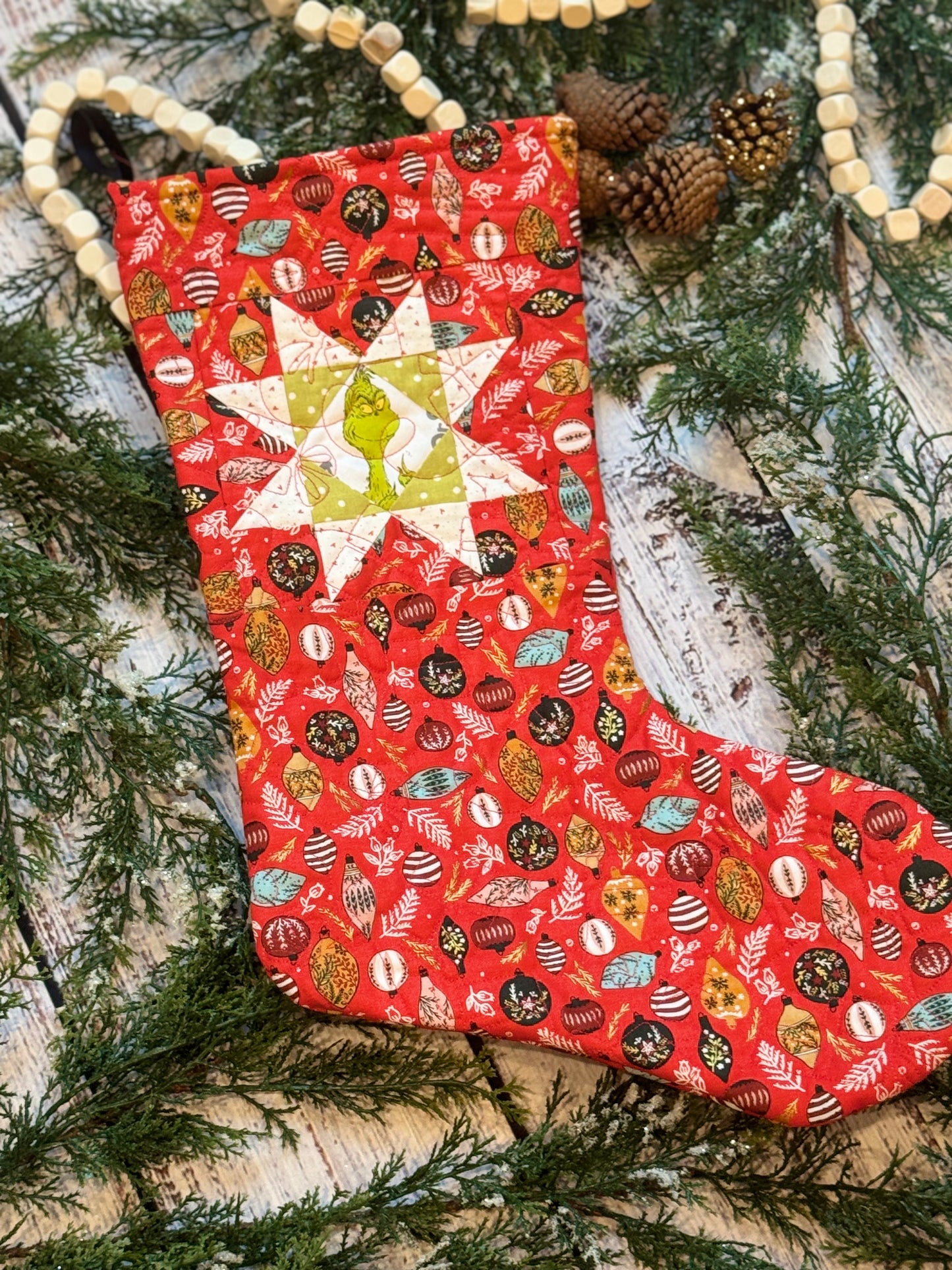 The Grinch Stocking with Red Ornaments